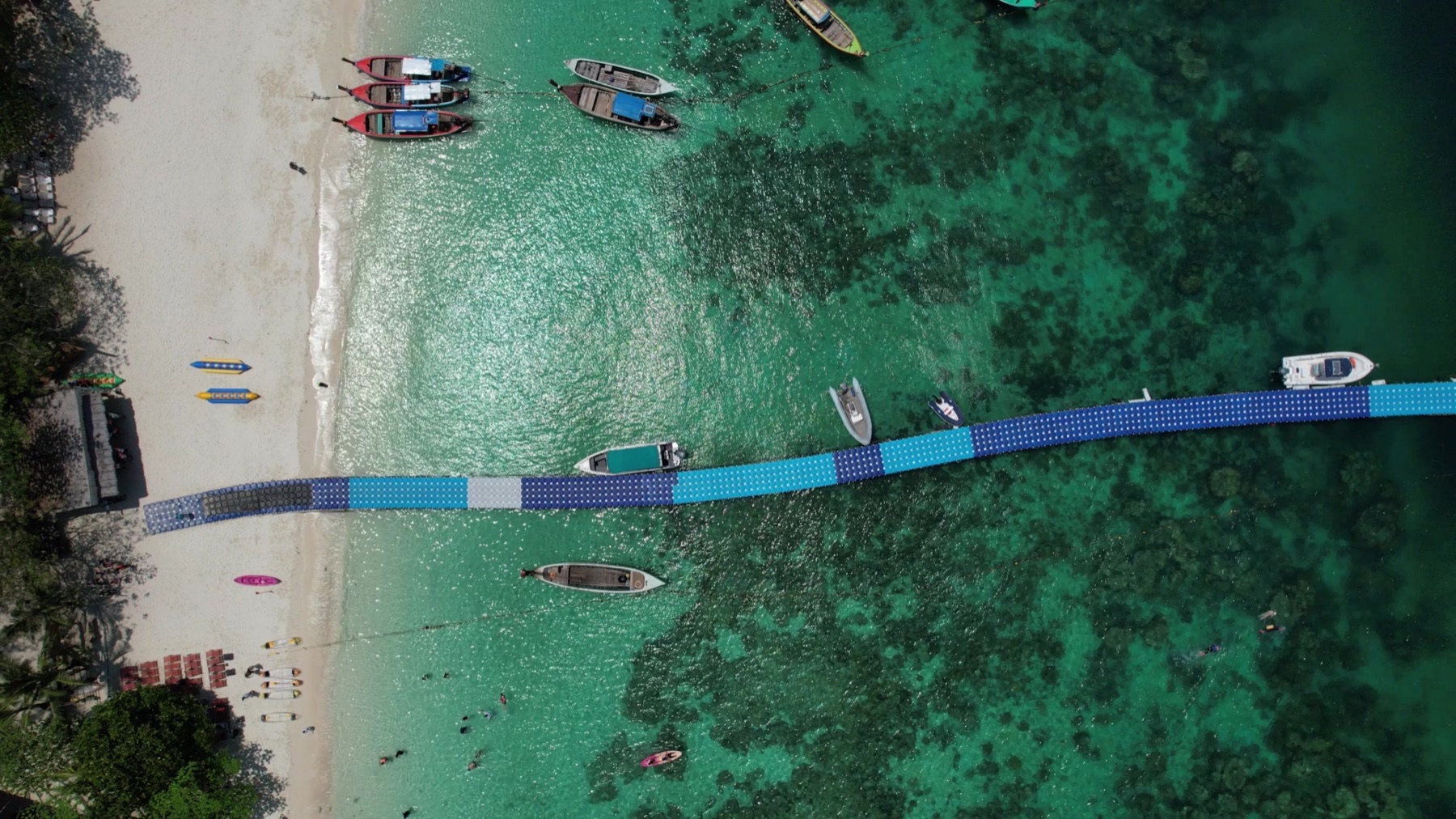 Aerial view of the beach and water at Coral Island, Phuket